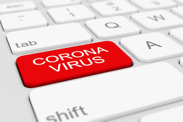 Tastatur mit einem roten Feld "Corona-Virus".