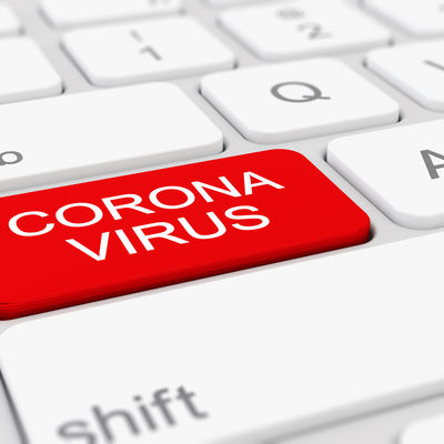 Tastatur mit einem roten Feld "Corona-Virus".